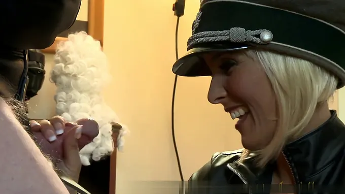 Horny Nazi girl is slapping this old dude's ass with a sex stick hard