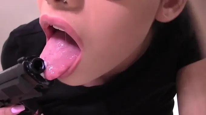 Hot Lara Croft is masturbating with her gun, rubbing it on her pussy