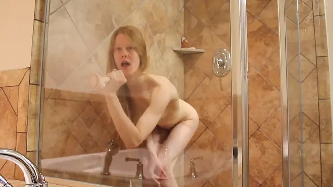 Sexy babe is all naked taking shower stimulating her pussy hole