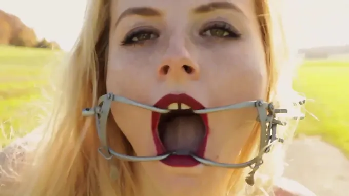 Skinny babe with small boobs walking in the field and gets her face stretched