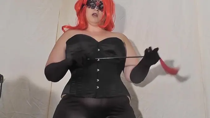 Nasty whore wearing latex costume and ready to abuse her slave rough