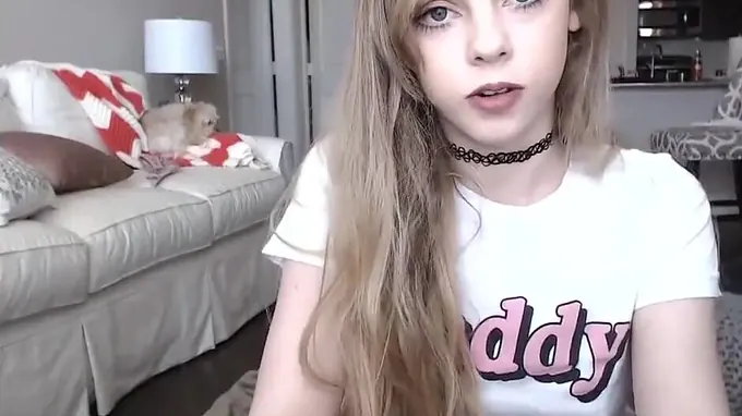 Cute kitty is posing on camera showing her tits and starts masturbating