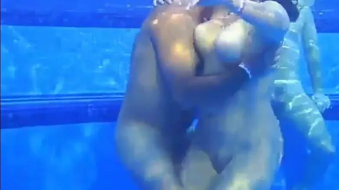 Horny babe in the swimming pool gets her cunt fingered seductively