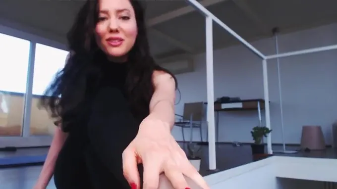 Horny brunette is posing on the floor stretching out her fine body