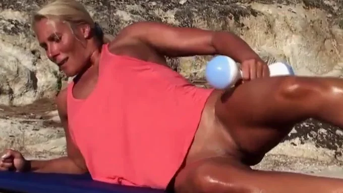 Blonde milf working out naked on the beach looking amazingly hot