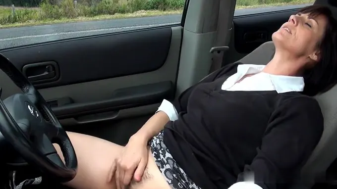 Filthy mature whore fingers her cunt hole on the back seat of her car