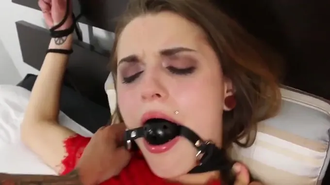 Nasty whore with a strap on in her mouth gets vagina hole abused
