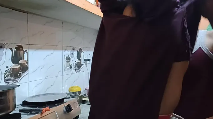 Hot Indian teen with big tits gets frisky in the kitchen with her boyfriend