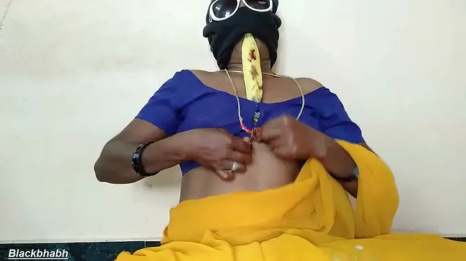 Naughty Aunty from South Mallu takes on a giant banana in her tight pussy