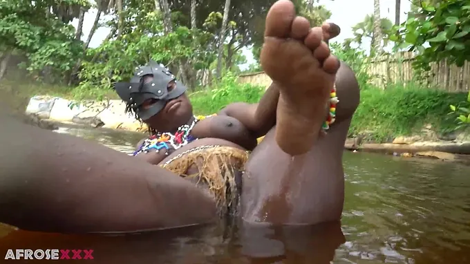 Jolie Sweetheart fondles her black gash in a subtropic woods for your viewing elation