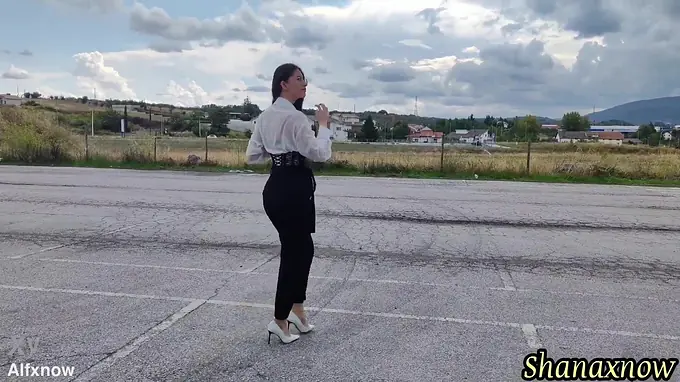 Cute teen with long hair and a high heels gets a wet and wild outdoor shower