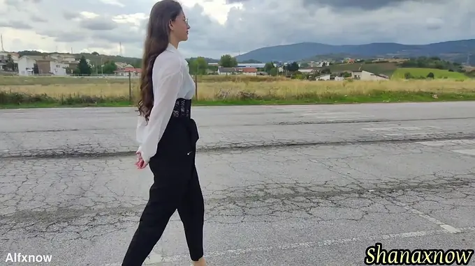 Cute teen with long hair and a high heels gets a wet and wild outdoor shower