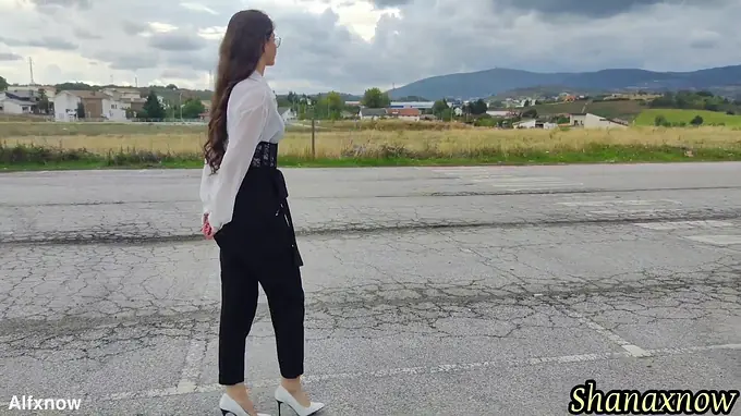 Cute teen with long hair and a high heels gets a wet and wild outdoor shower