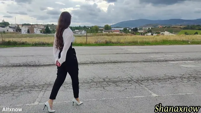 Cute teen with long hair and a high heels gets a wet and wild outdoor shower